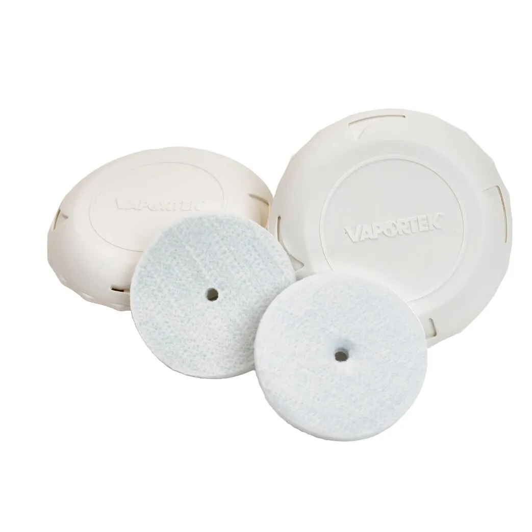 Two round white plastic containers labeled EZ-Twist are shown with two white circular filter pads placed in front of them.