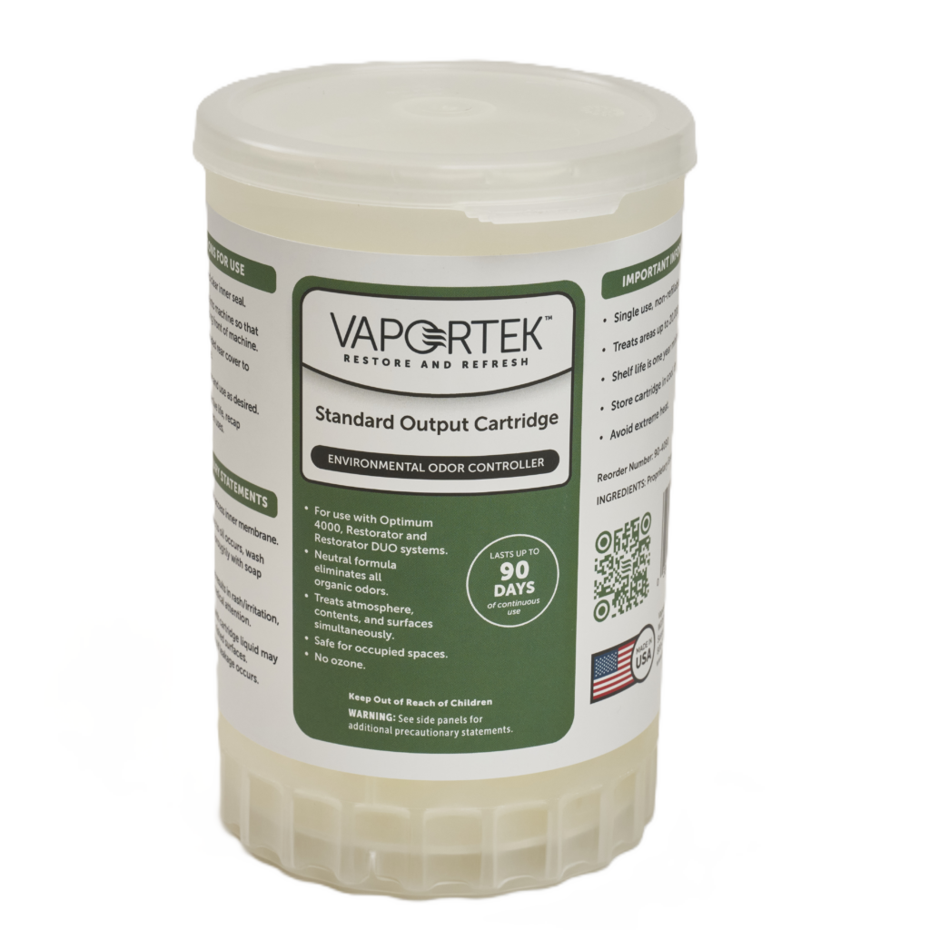 A Vapotek Standard Output Cartridge for environmental odor control, featuring a white cylindrical container with green and black text, used for odor neutralization in various spaces.